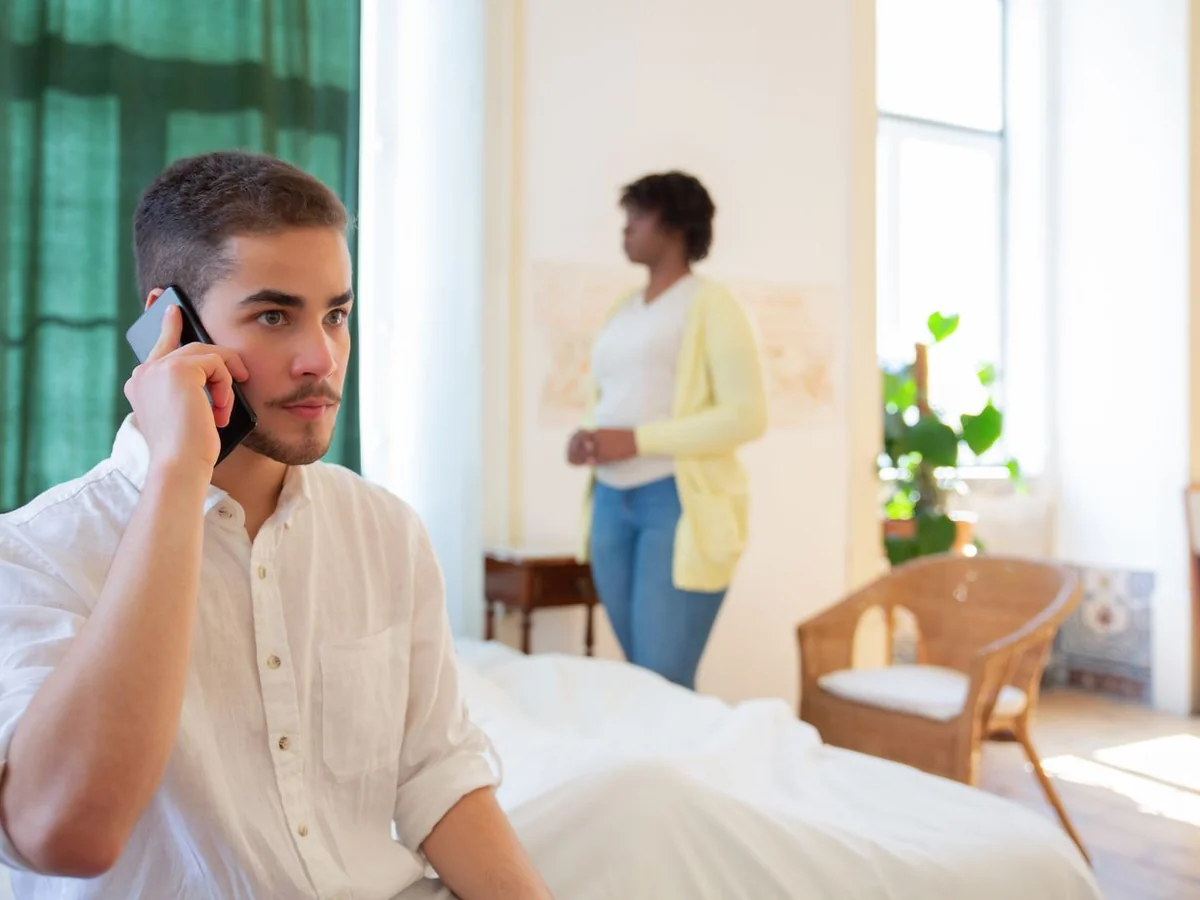A caregiver speaking on the phone in a home setting